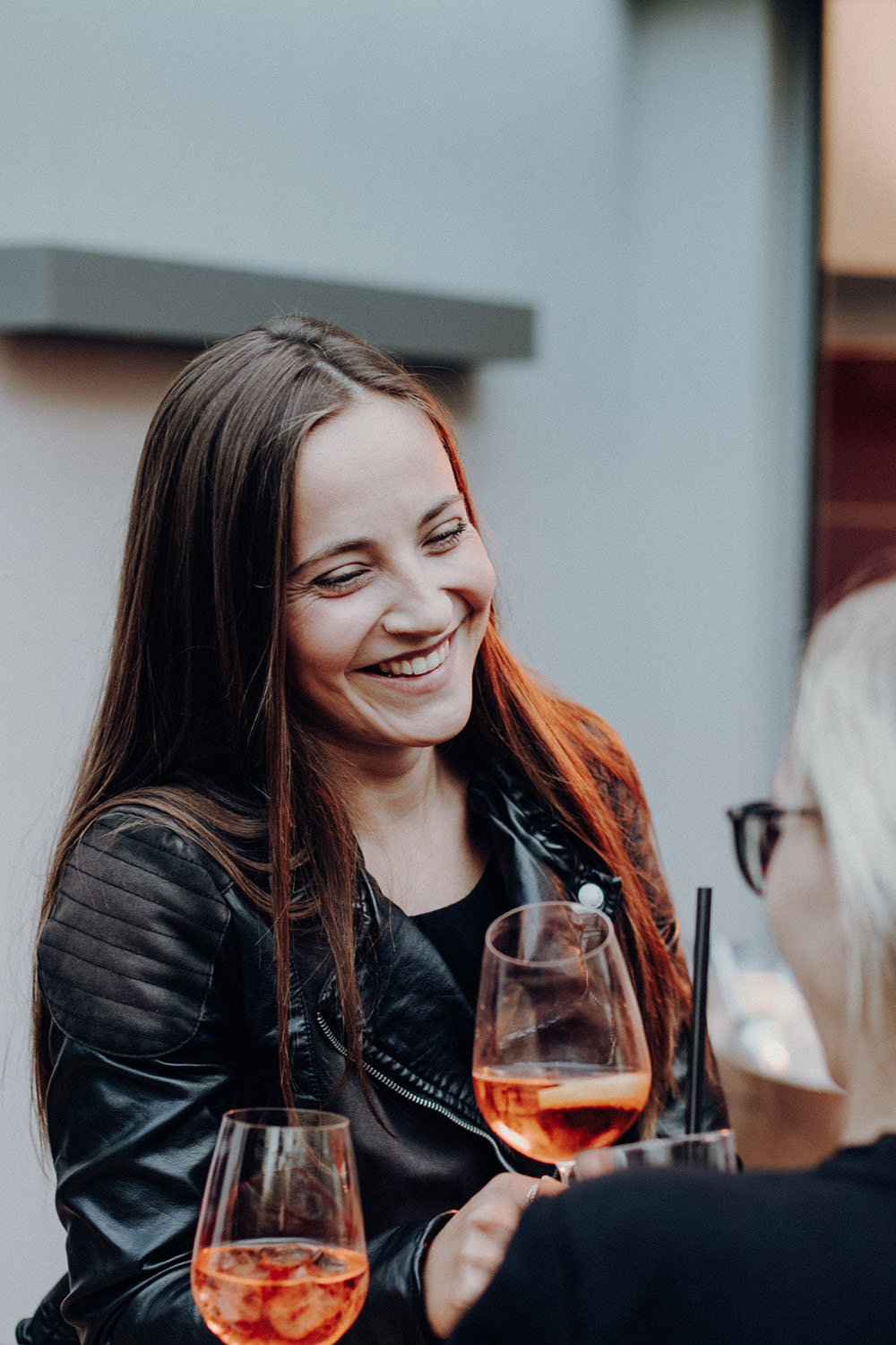 Smiling woman with a glass of rosé